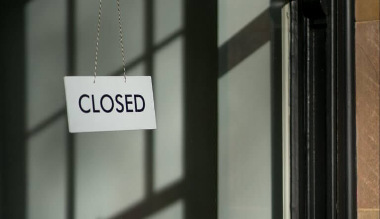 white closed hanging signage
